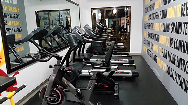 Cardio zone with treadmills, elliptical and spin bike at SPARTANS Gym